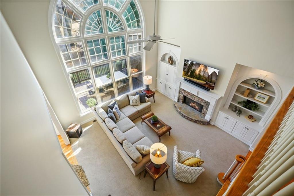 1260 Elk Ridge Cove Alpharetta, GA 30005 - Photo 28 of 87 walk in closet with wooden floor
