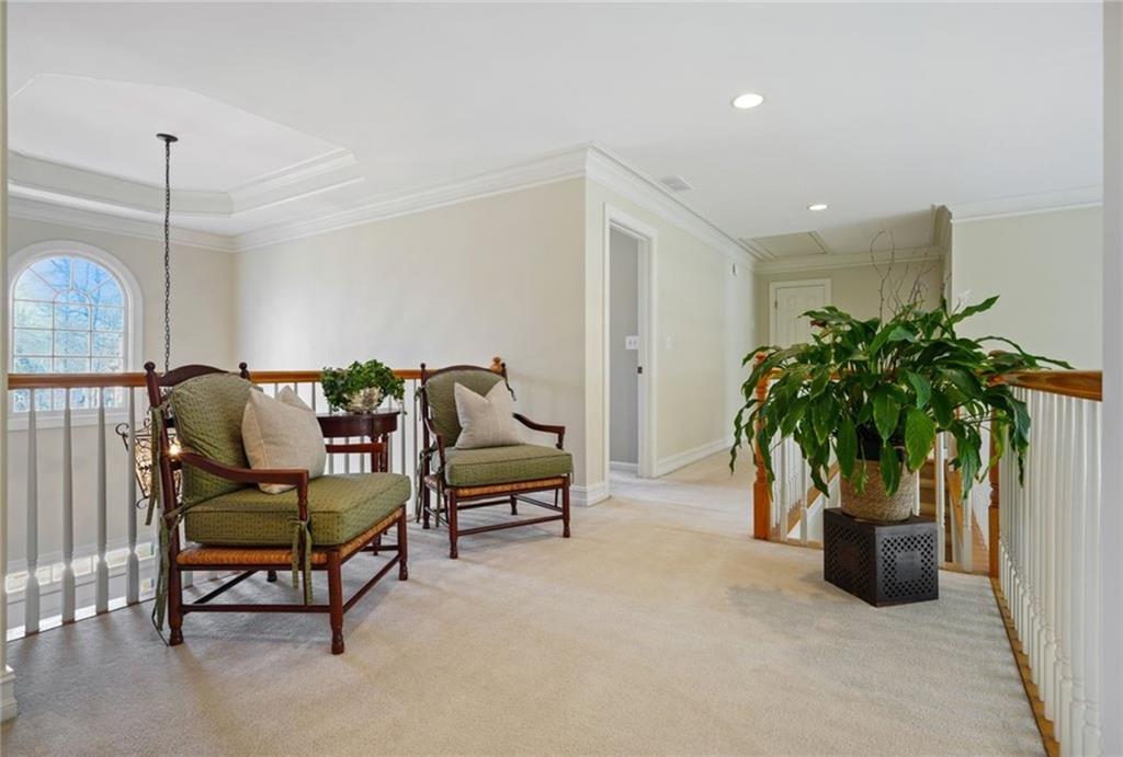 1260 Elk Ridge Cove Alpharetta, GA 30005 - Photo 29 of 87 a living room with furniture and a potted plant