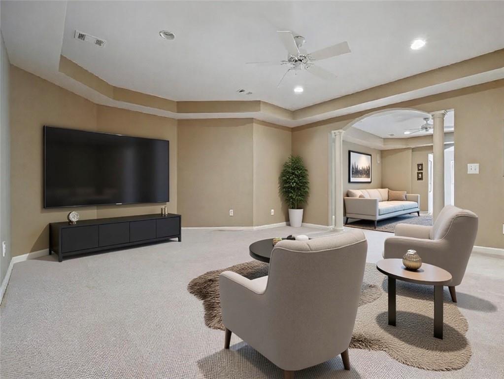 1260 Elk Ridge Cove Alpharetta, GA 30005 - Photo 51 of 87 a living room with furniture and a flat screen tv