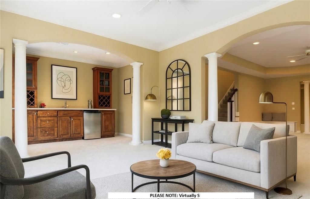1260 Elk Ridge Cove Alpharetta, GA 30005 - Photo 53 of 87 a living room with furniture and wooden floor
