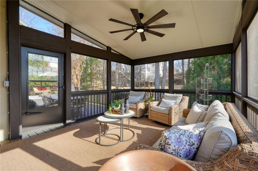 1260 Elk Ridge Cove Alpharetta, GA 30005 - Photo 60 of 87 a living room with furniture and a large window