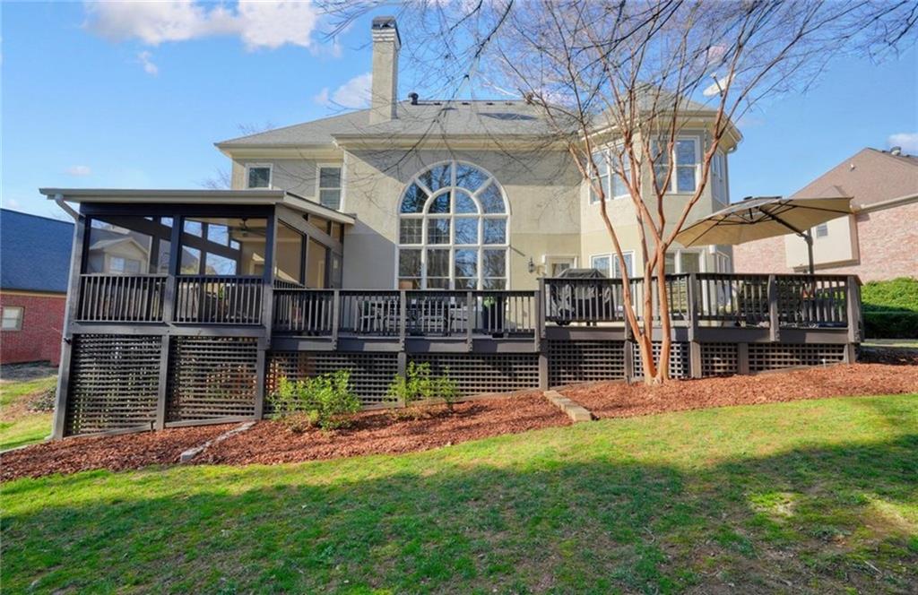 1260 Elk Ridge Cove Alpharetta, GA 30005 - Photo 69 of 87 a view of a house with a yard