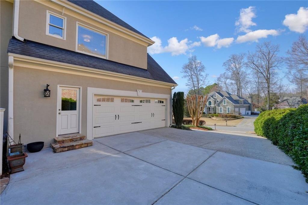 1260 Elk Ridge Cove Alpharetta, GA 30005 - Photo 71 of 87 a view of a house with a yard