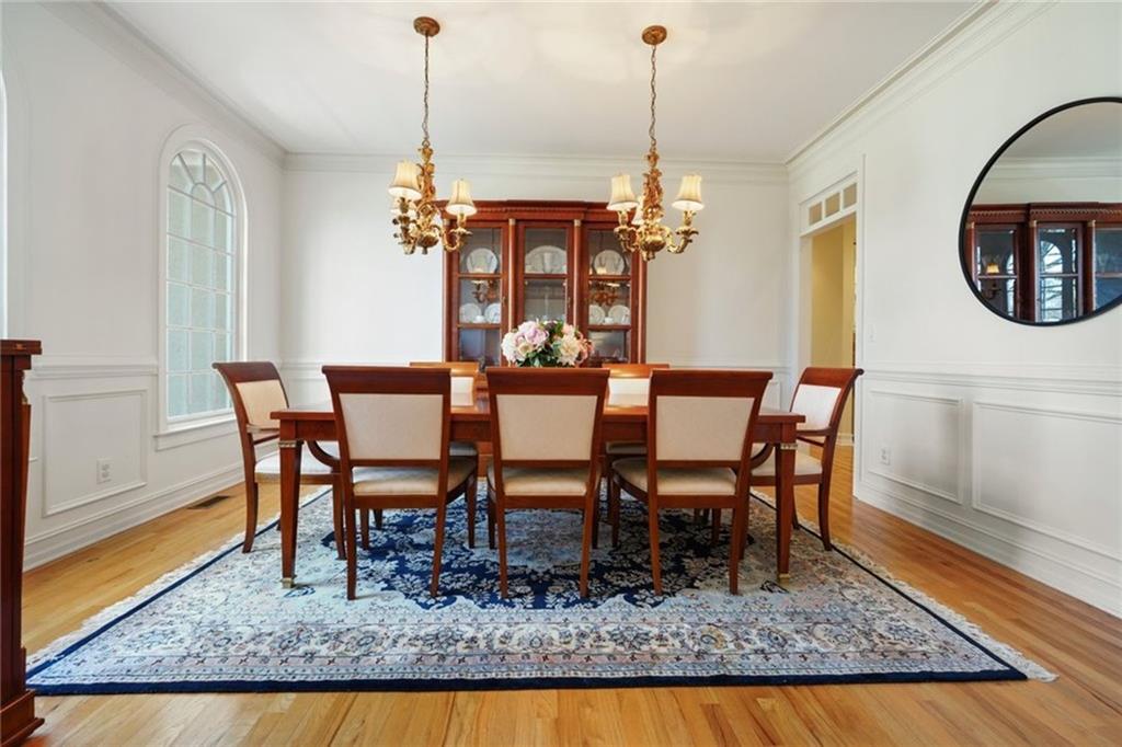 1260 Elk Ridge Cove Alpharetta, GA 30005 - Photo 8 of 87 a view of a dining room with furniture