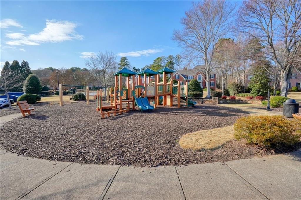 1260 Elk Ridge Cove Alpharetta, GA 30005 - Photo 82 of 87 a view of a park with swings and slides