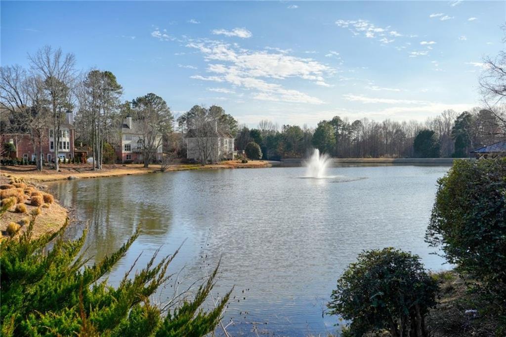 1260 Elk Ridge Cove Alpharetta, GA 30005 - Photo 87 of 87 a view of a lake with houses in the back
