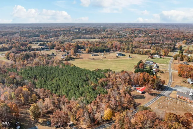 an aerial view of residential building and lake
