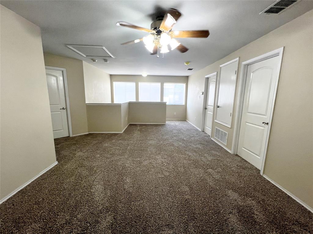 8813 Chisholm Trail Cross Roads, TX 76227 - Photo 16 of 24 a view of an empty room with a window