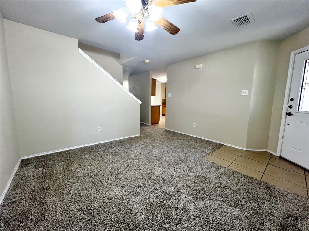 8813 Chisholm Trail Cross Roads, TX 76227 - Photo 3 of 24 en empty room with wooden floor and ceiling fan