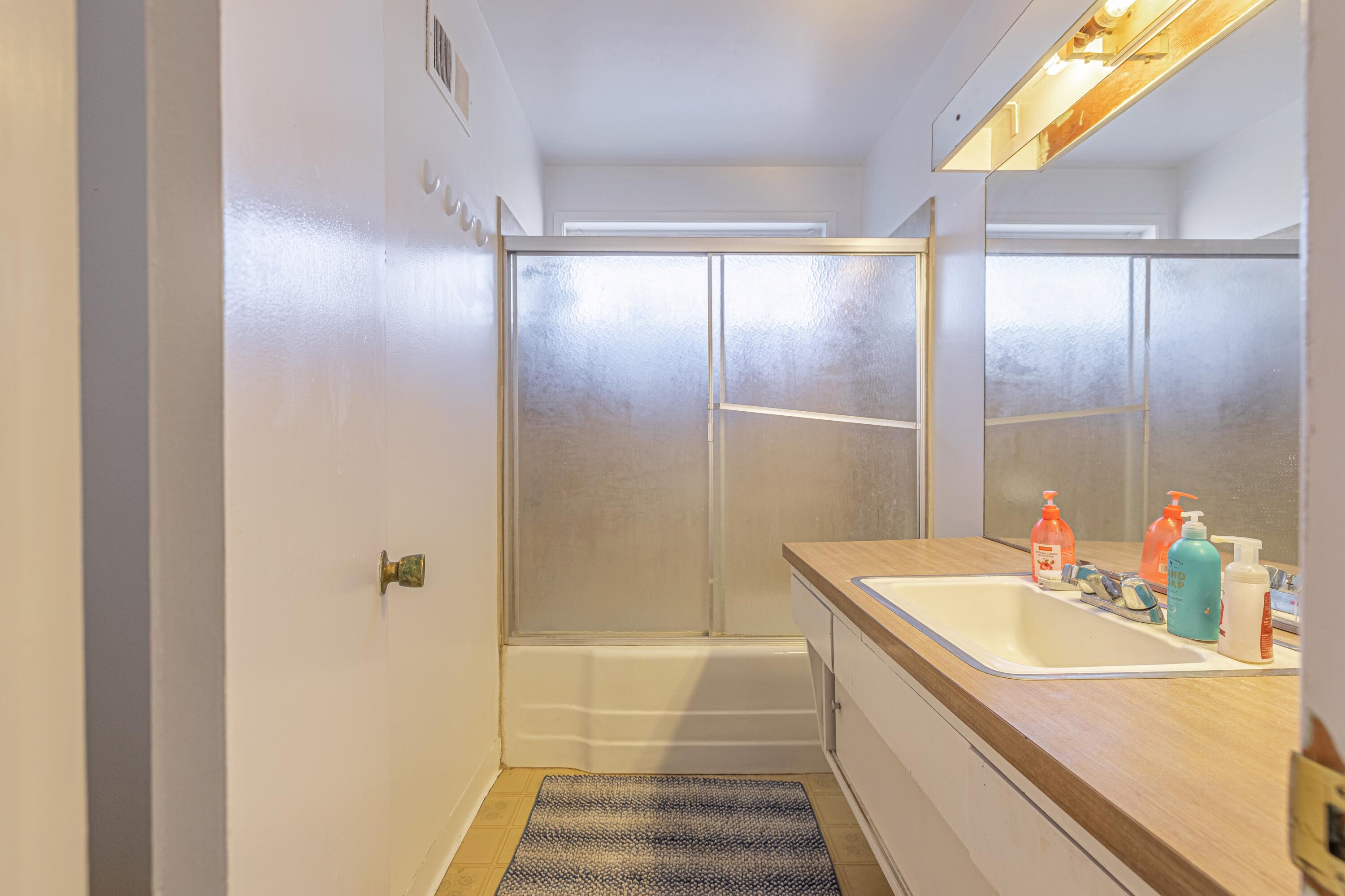 1108 Valiant Street Lancaster, CA 93534 - Photo 12 of 21 a bathroom with a sink and a mirror
