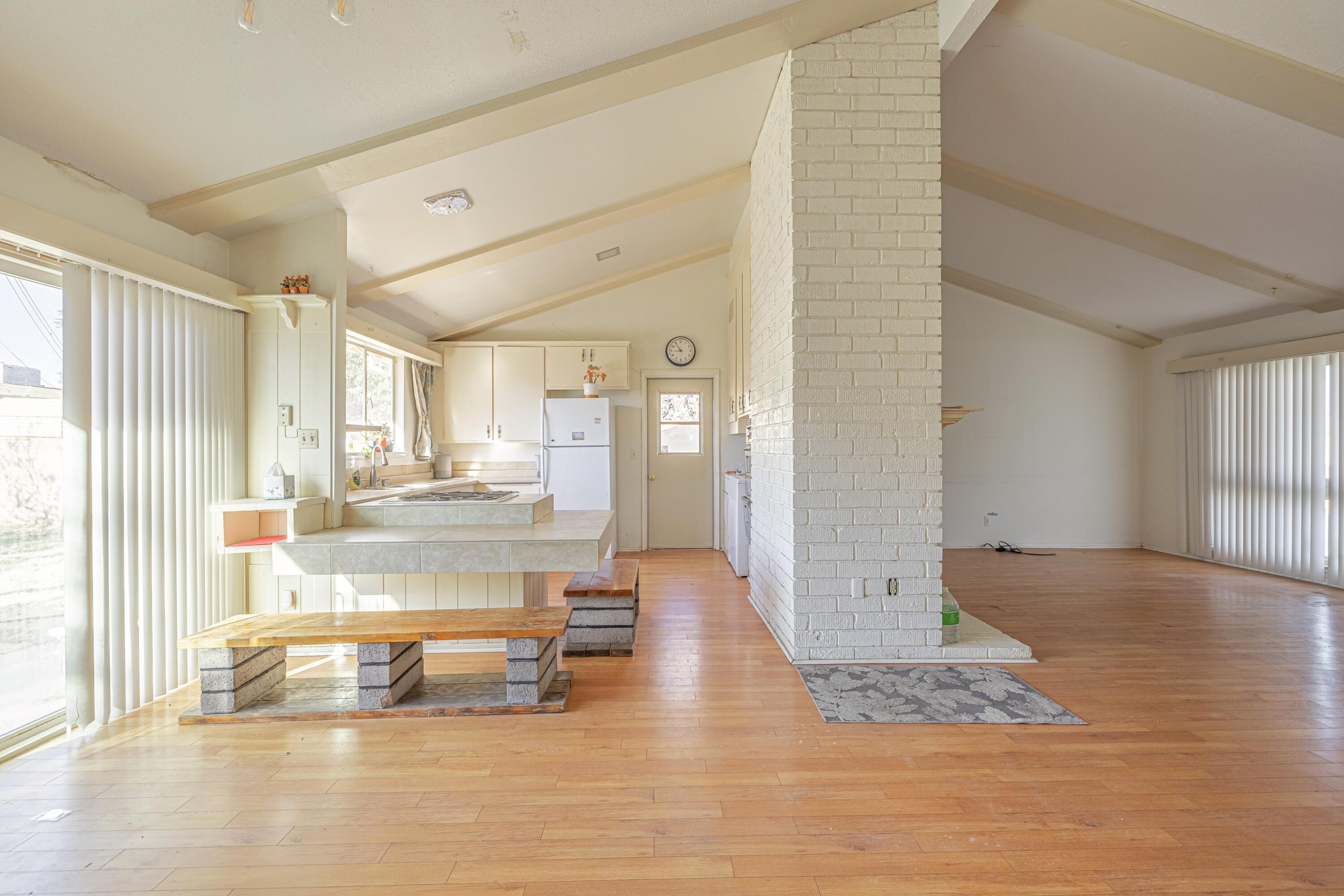 1108 Valiant Street Lancaster, CA 93534 - Photo 8 of 21 a living room with kitchen island granite countertop furniture and a fireplace