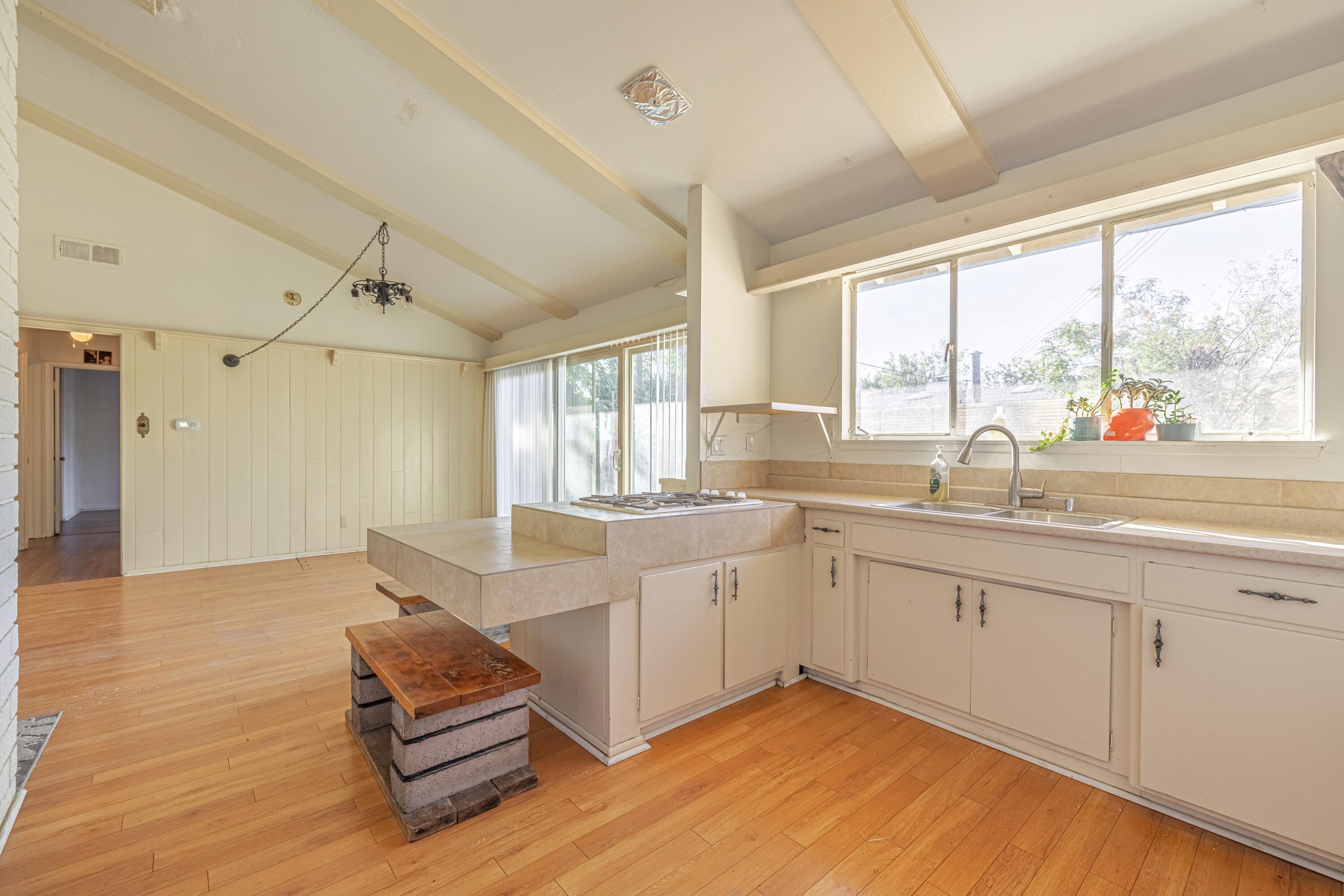 1108 Valiant Street Lancaster, CA 93534 - Photo 9 of 21 a large white kitchen with a large window