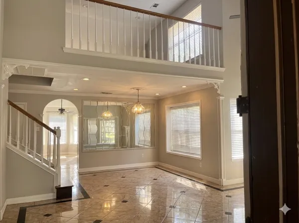 a view of an entryway with wooden floor