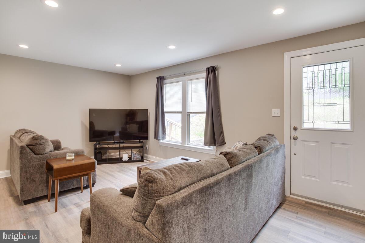 482 Round Up Road Lusby, MD 20657 - Photo 2 of 19 a living room with furniture and a flat screen tv