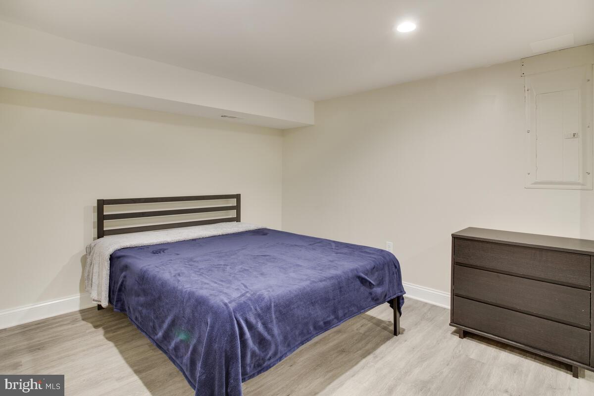 482 Round Up Road Lusby, MD 20657 - Photo 13 of 19 a bedroom with a bed and cabinet