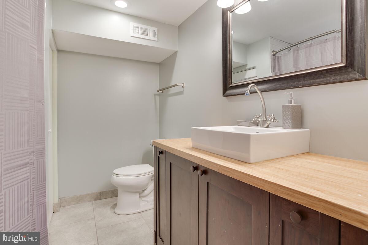 482 Round Up Road Lusby, MD 20657 - Photo 14 of 19 a bathroom with a sink and a toilet
