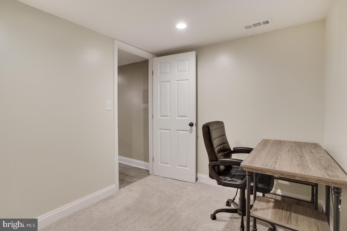 482 Round Up Road Lusby, MD 20657 - Photo 16 of 19 a view of a workspace with furniture