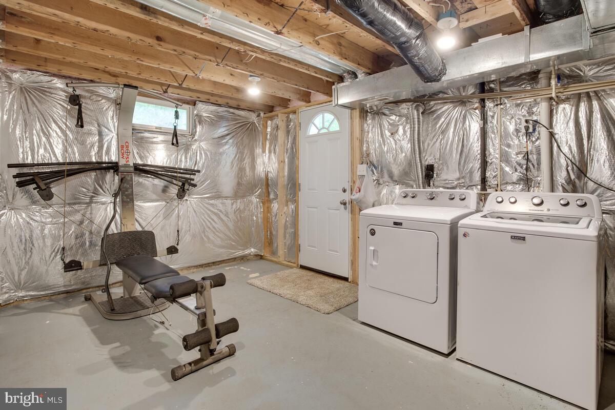 482 Round Up Road Lusby, MD 20657 - Photo 17 of 19 a view of a storage & utility room with dryer and washer