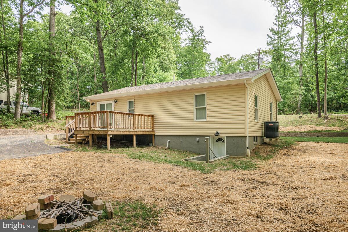 482 Round Up Road Lusby, MD 20657 - Photo 19 of 19 a view of a house with a yard