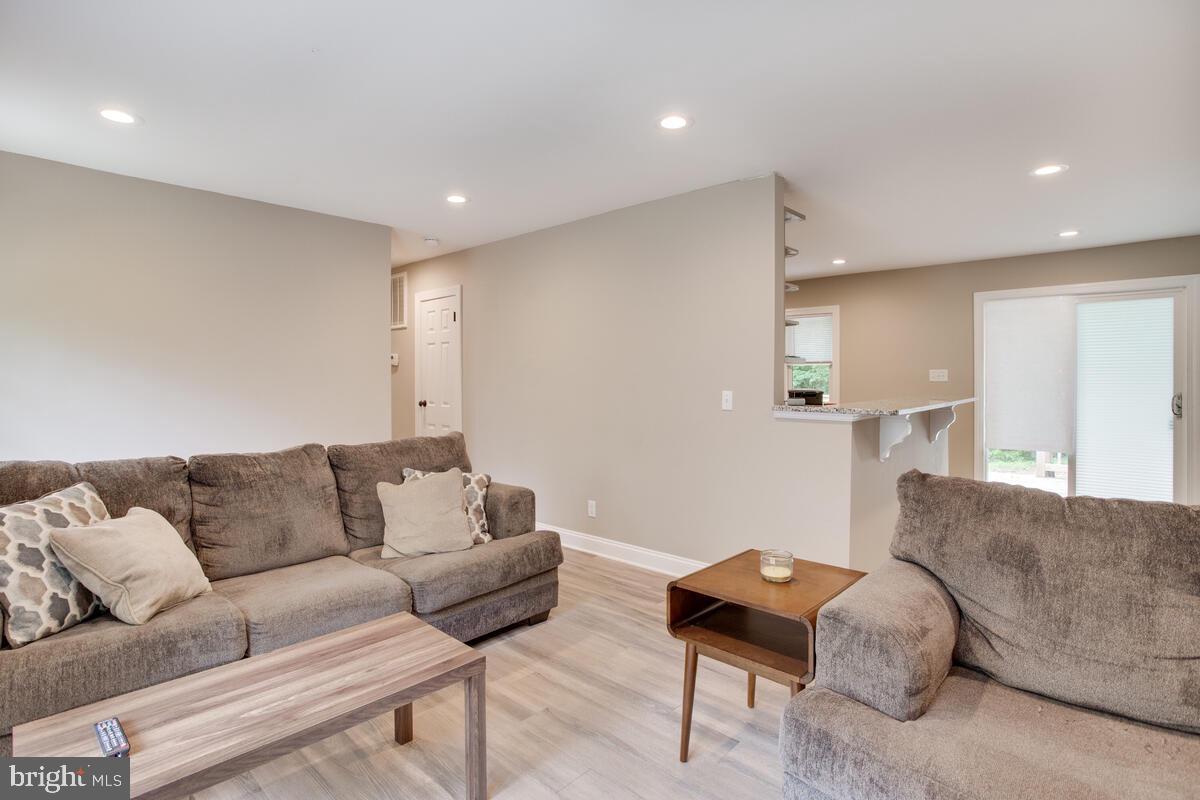 482 Round Up Road Lusby, MD 20657 - Photo 3 of 19 a living room with furniture and a couch