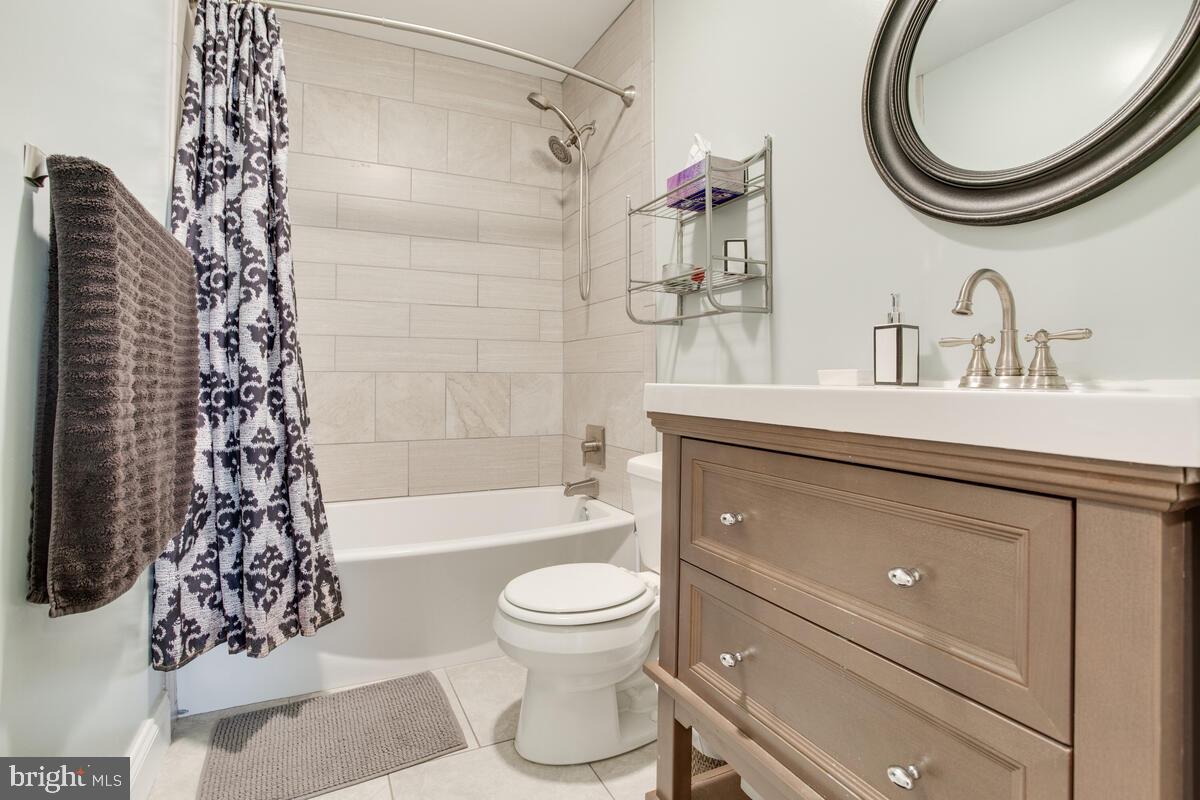 482 Round Up Road Lusby, MD 20657 - Photo 6 of 19 a bathroom with a sink toilet a mirror and shower