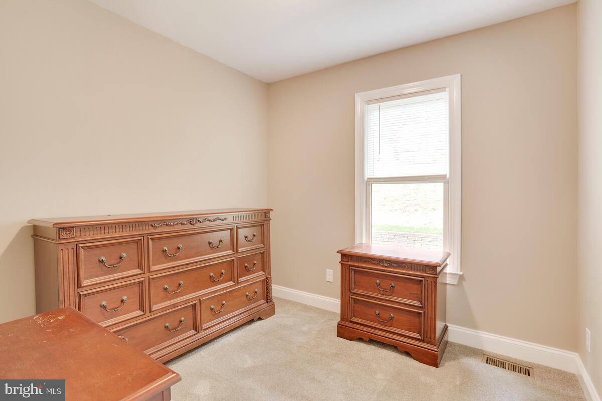482 Round Up Road Lusby, MD 20657 - Photo 7 of 19 an empty room with furniture and a window