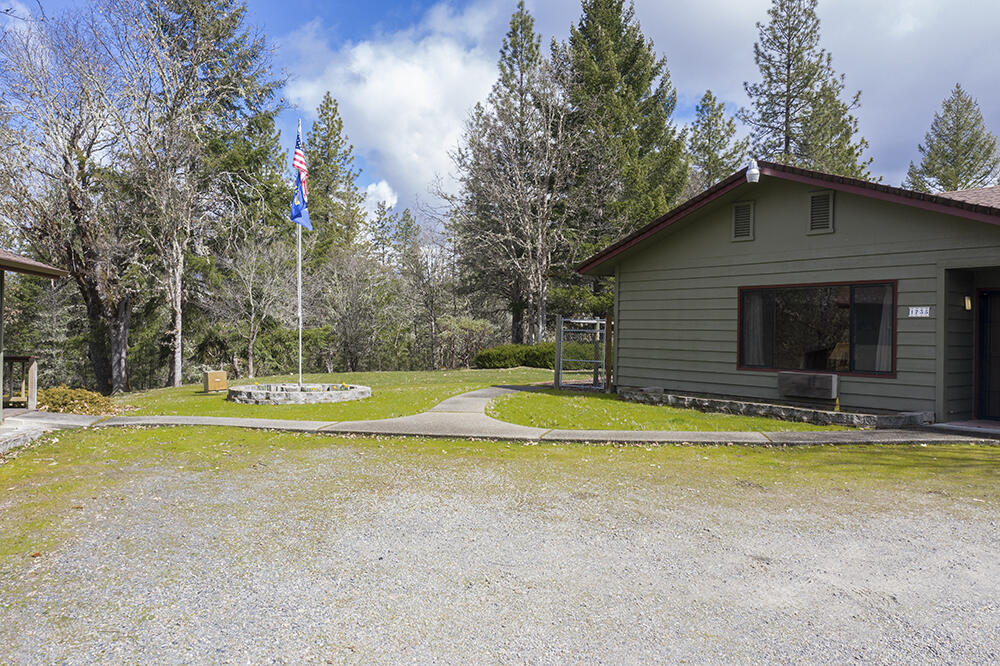 1735 Robertson Bridge Road Grants Pass, OR 97526 - Photo 32 of 47 a view of a swimming pool with an outdoor space and seating area