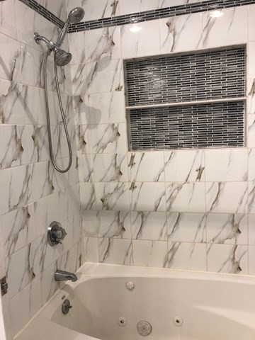 227 Bowen Street, Unit 3 Boston, MA 02127 - Photo 4 of 9 a bathroom with a bathtub and a shower