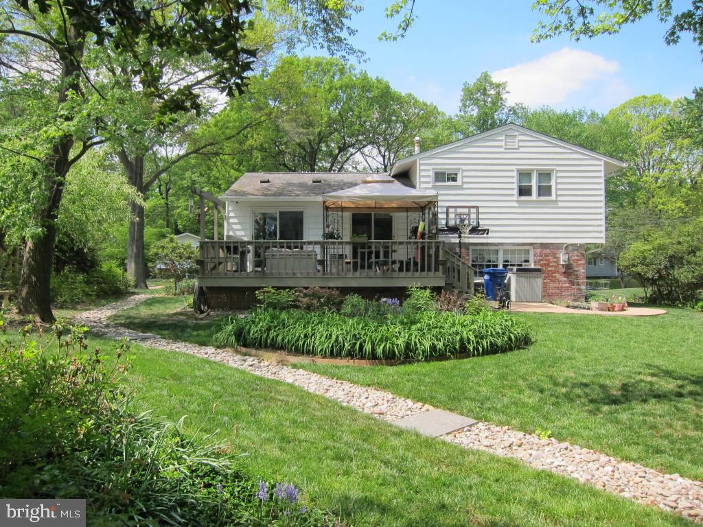 8225 Crown Court Road Alexandria, VA 22308 - Photo 2 of 57 Rear view of house showing deck and patio