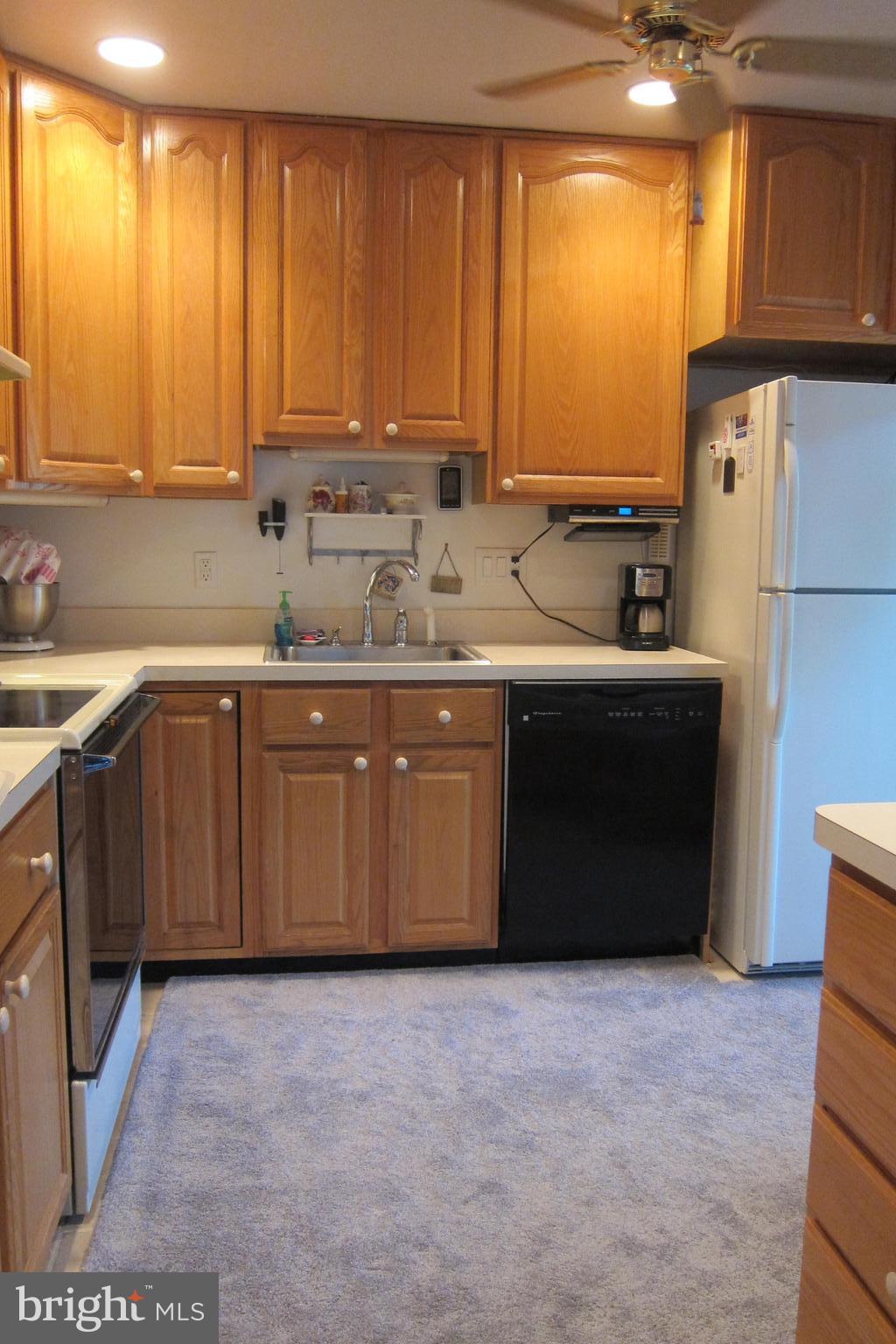 8225 Crown Court Road Alexandria, VA 22308 - Photo 11 of 57 Kitchen with ceramic tile flooring, tall cabinets