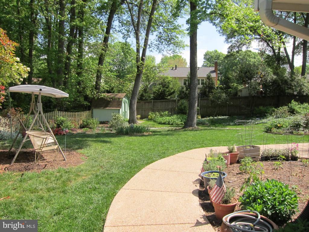 8225 Crown Court Road Alexandria, VA 22308 - Photo 32 of 57 Back yard with curving path & swing that conveys