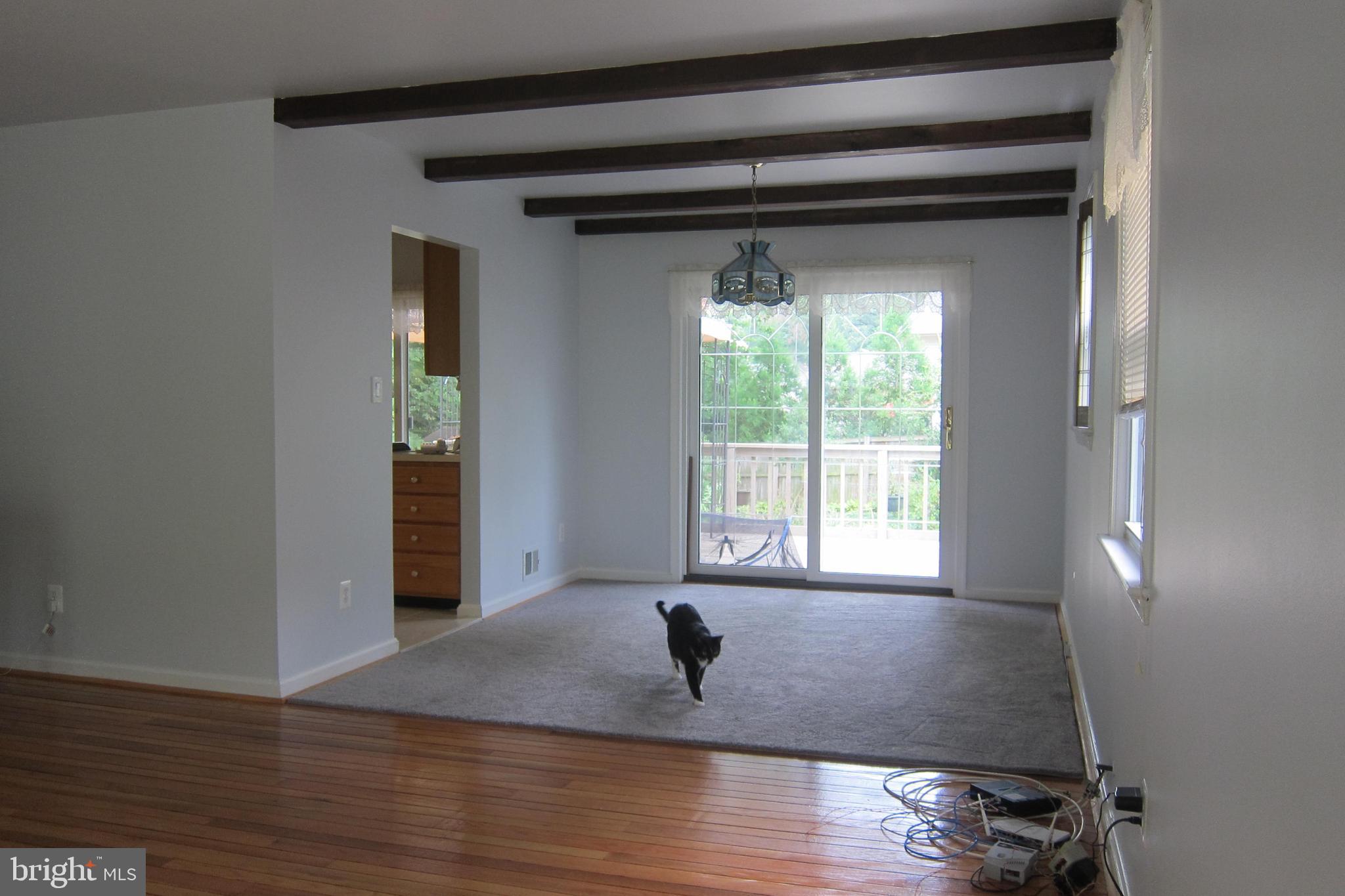 8225 Crown Court Road Alexandria, VA 22308 - Photo 7 of 57 Living room to Dining room w/kitchen & deck access