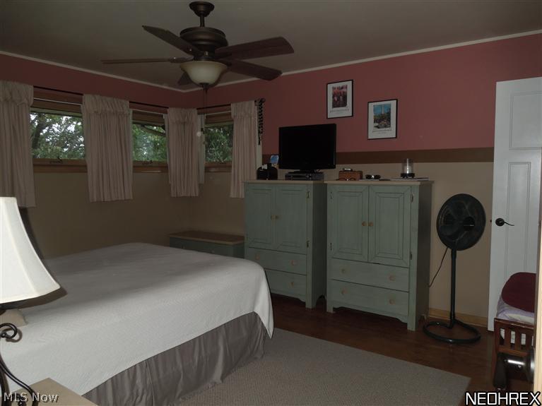 4604 5th Street Northwest Canton, OH 44708 - Photo 11 of 25 The spacious master bedroom features hard wood floors and lots of windows to let the natural sun light in or the Fall breeze! The walls are painted and very tastefully done!