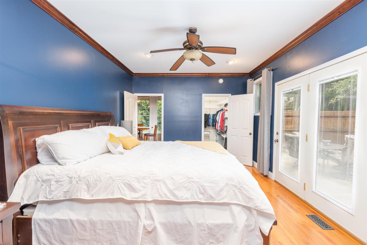 975 Limestone Road Mount Sidney, VA 24467 - Photo 21 of 49 a bed room with a bed and a large mirror