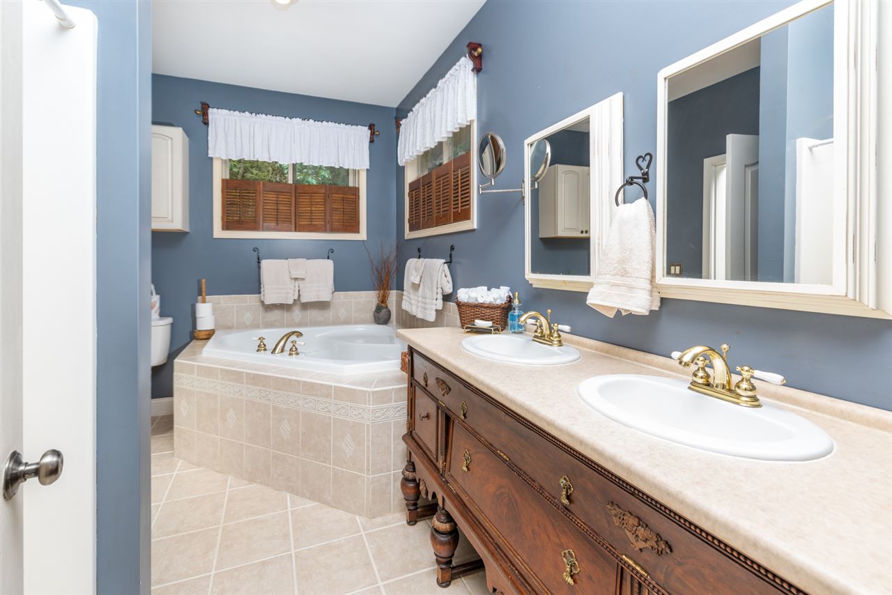 975 Limestone Road Mount Sidney, VA 24467 - Photo 24 of 49 a bathroom with a sink and a mirror