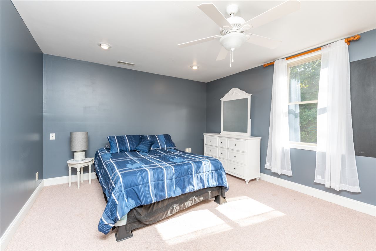 975 Limestone Road Mount Sidney, VA 24467 - Photo 31 of 49 a bedroom with a large bed and a window