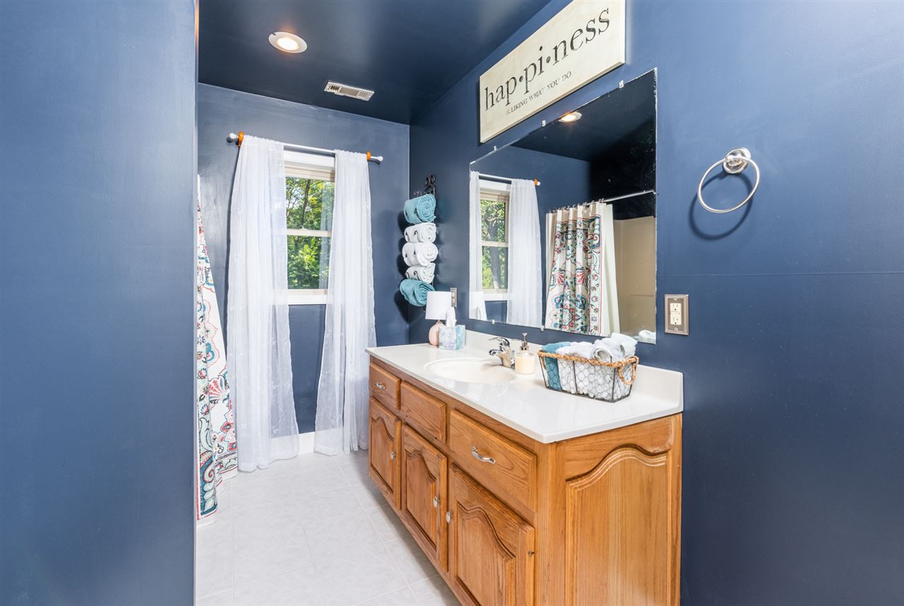 975 Limestone Road Mount Sidney, VA 24467 - Photo 33 of 49 a spacious bathroom with a double vanity sink and a mirror