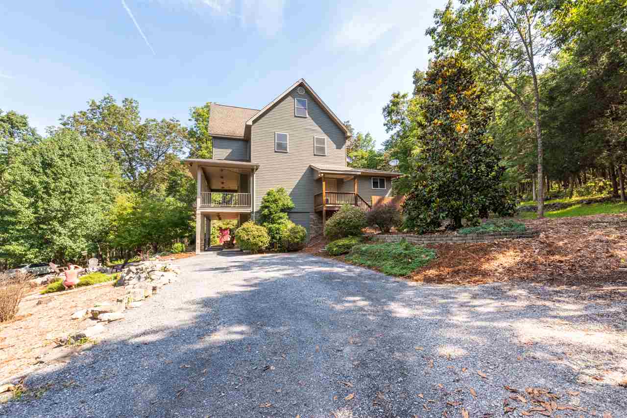 975 Limestone Road Mount Sidney, VA 24467 - Photo 49 of 49 a front view of a house with a yard and a garage