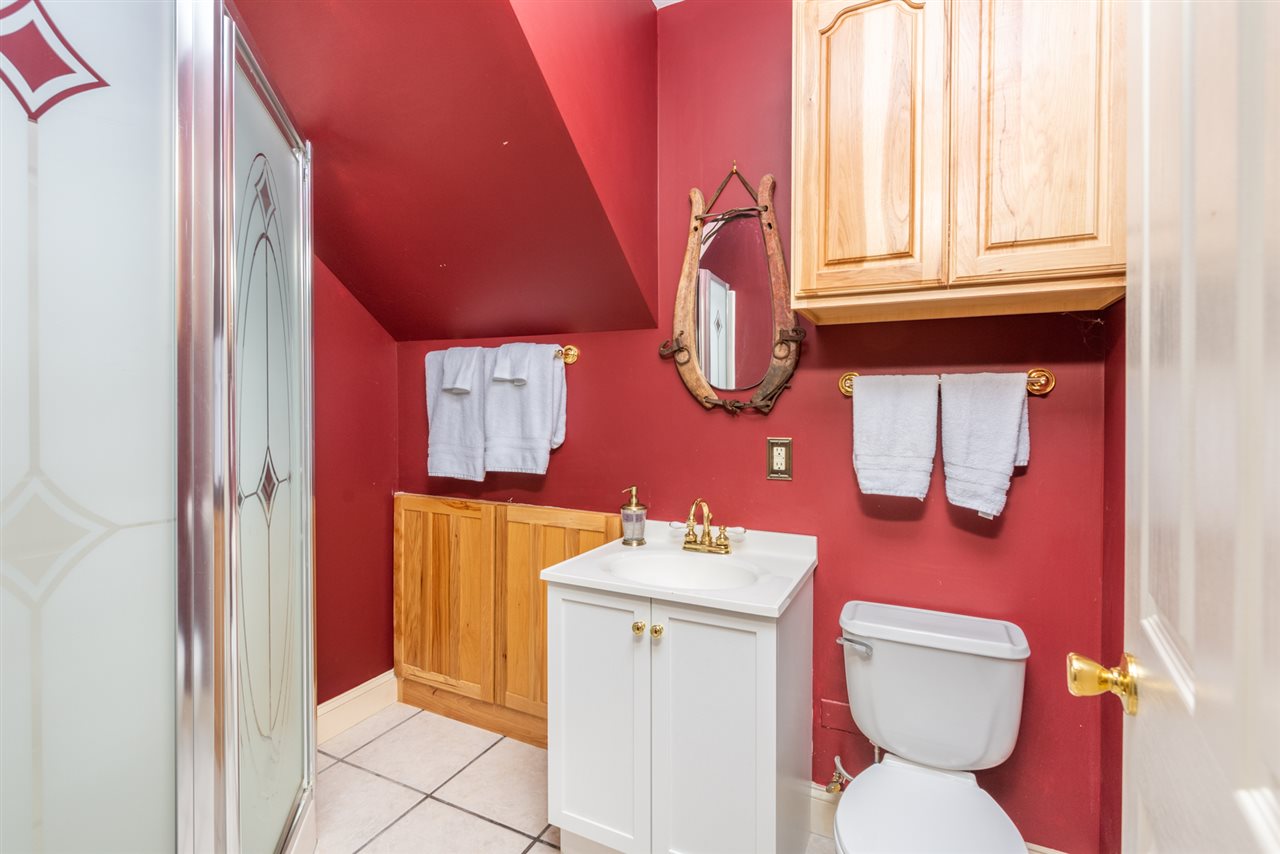 975 Limestone Road Mount Sidney, VA 24467 - Photo 8 of 49 a bathroom with a toilet sink and mirror