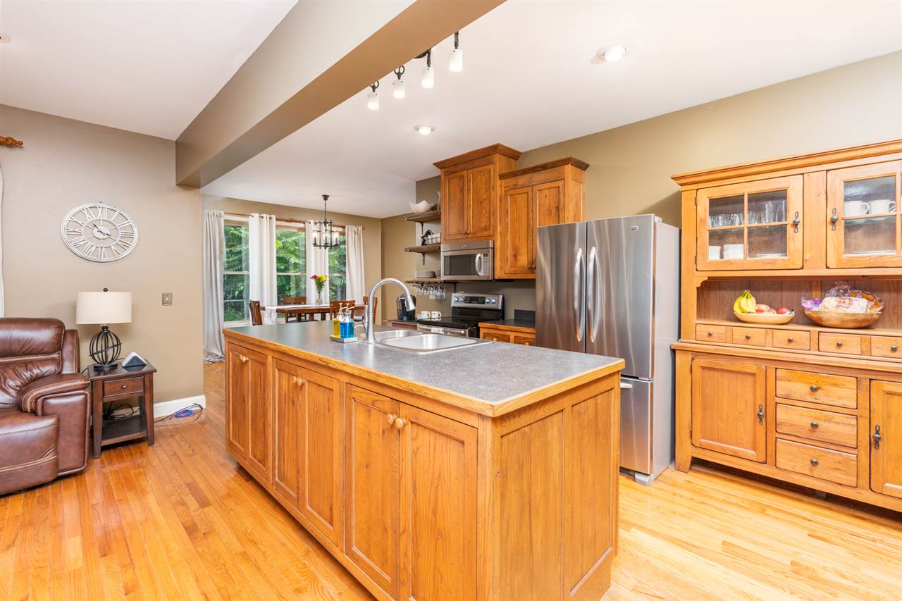 975 Limestone Road Mount Sidney, VA 24467 - Photo 10 of 49 a kitchen with stainless steel appliances a refrigerator a stove a sink and dishwasher with wooden floor