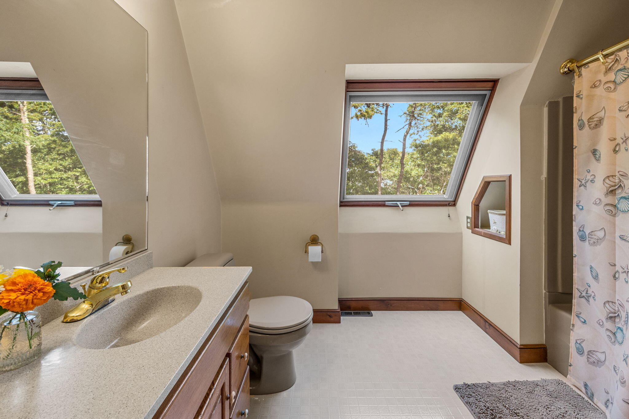 65 Cestaro Way Eastham, MA 02642 - Photo 19 of 40 a bathroom with a sink toilet and window