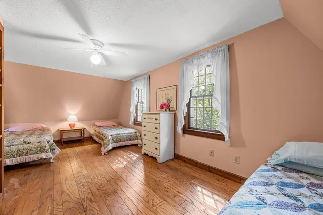 a bedroom with furniture and a window