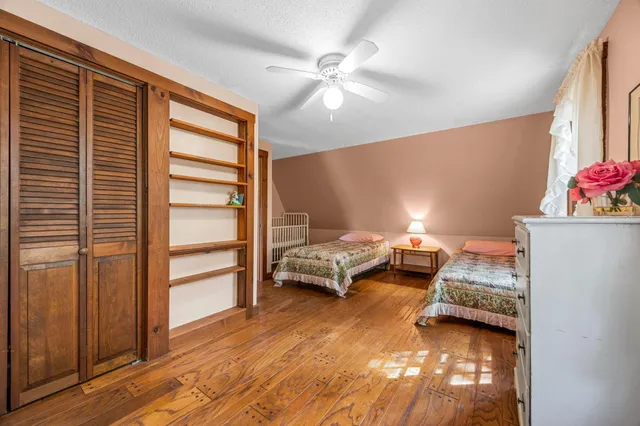 a bedroom with furniture and a window