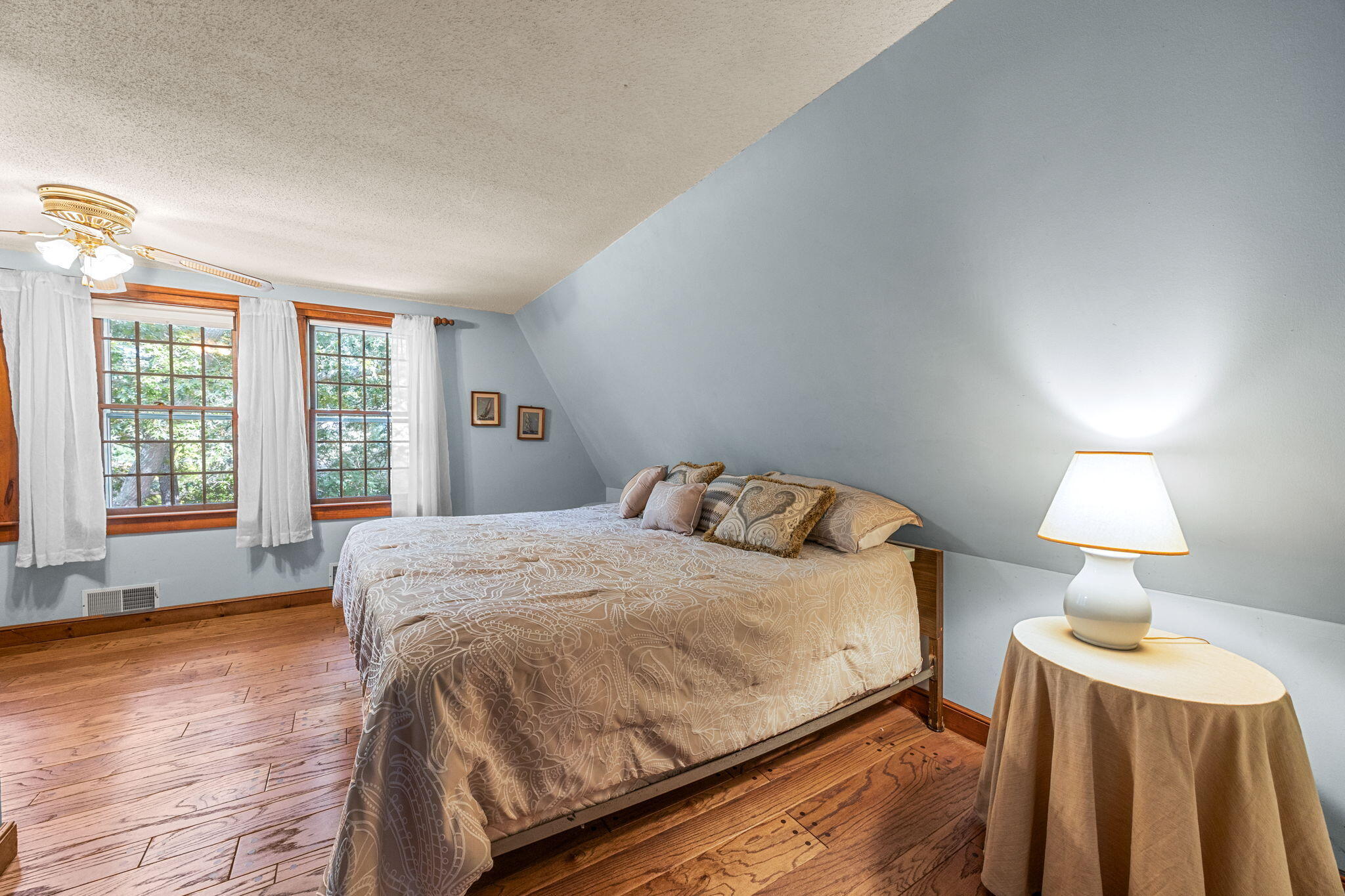 65 Cestaro Way Eastham, MA 02642 - Photo 25 of 40 a spacious bedroom with a bed and a lamp