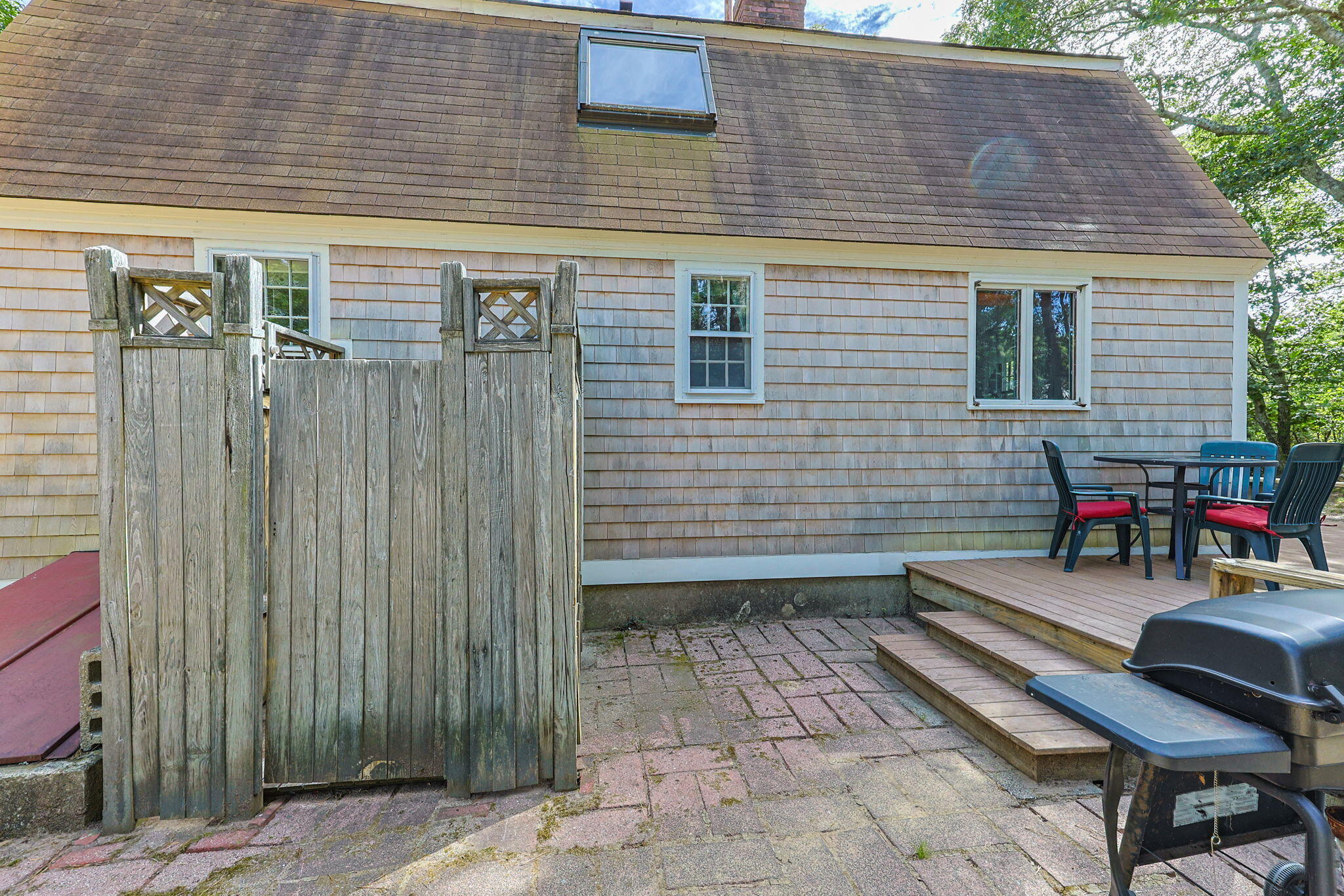 65 Cestaro Way Eastham, MA 02642 - Photo 30 of 40 a backyard of a house with seating space