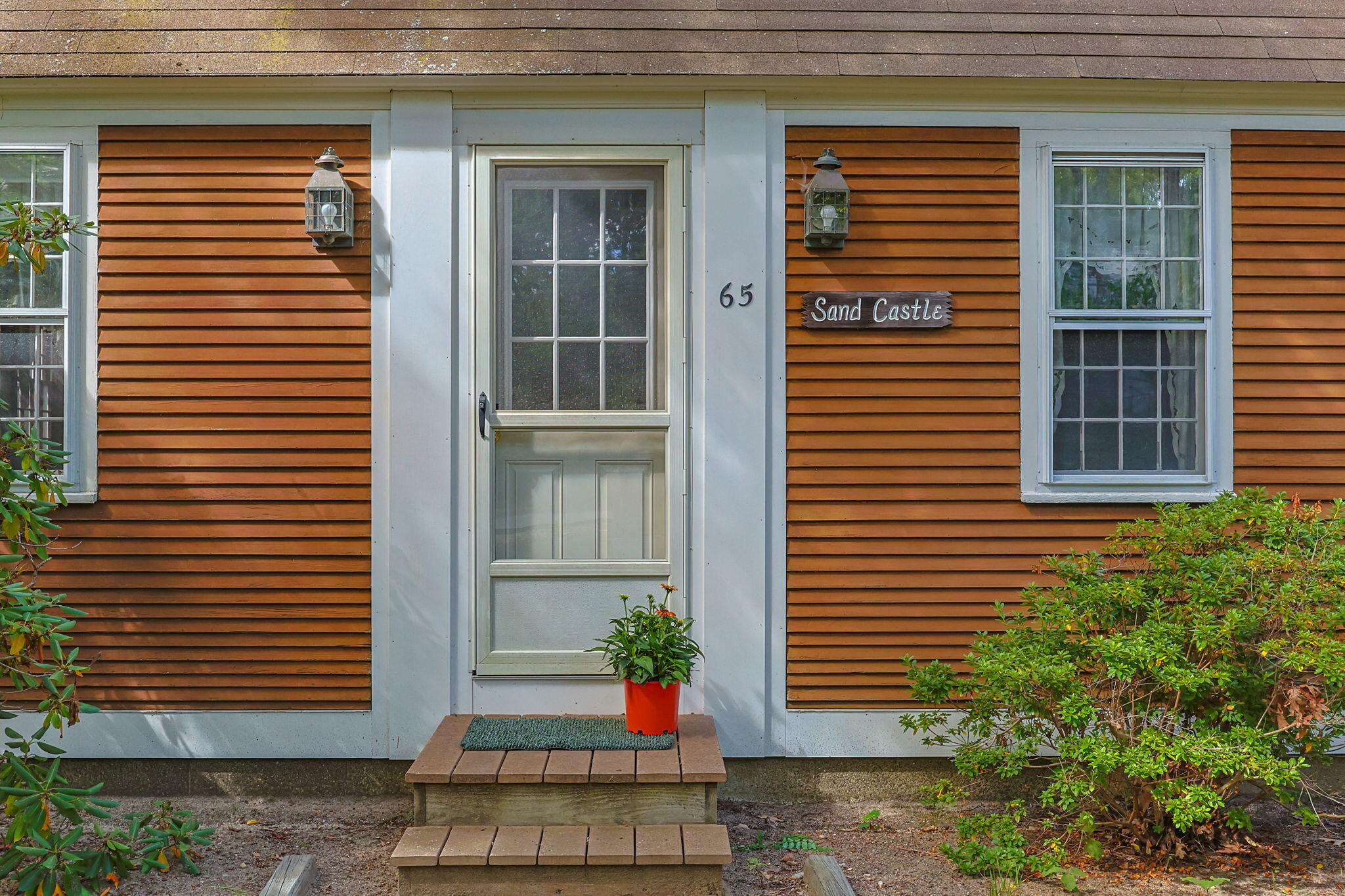 65 Cestaro Way Eastham, MA 02642 - Photo 4 of 40 a front view of a house with a yard