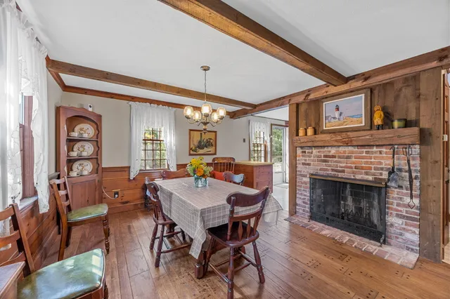 a view of a livingroom with furniture and a fireplace