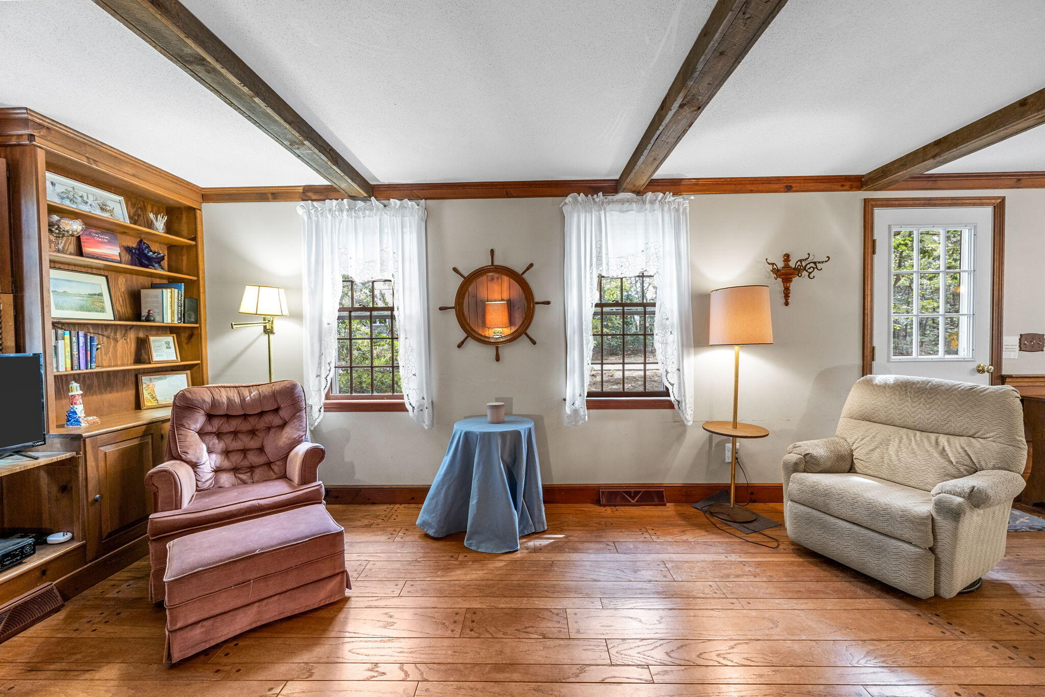 65 Cestaro Way Eastham, MA 02642 - Photo 9 of 40 a living room with furniture and a wooden floor