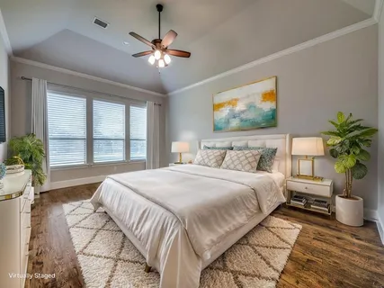 a bathroom with a bathtub shower sink and mirror