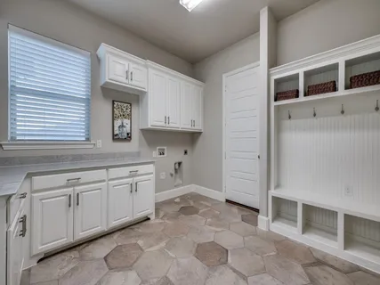 a kitchen with a sink and cabinets